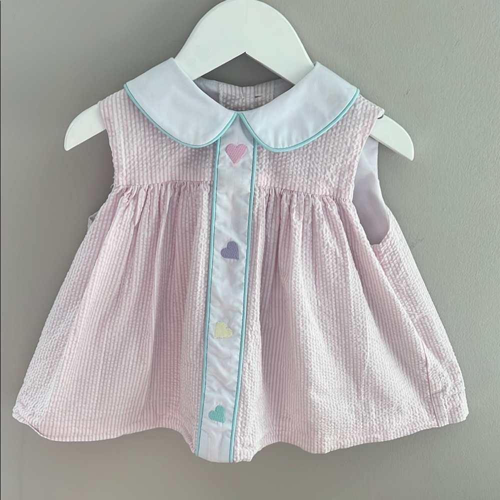Pink Sleeveless Baby Dress with Heart Accents and Teal Bloomers.
